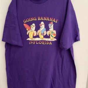 246. Vibrant Purple Graphic Tee - Surfing Bananas Design  NWOT